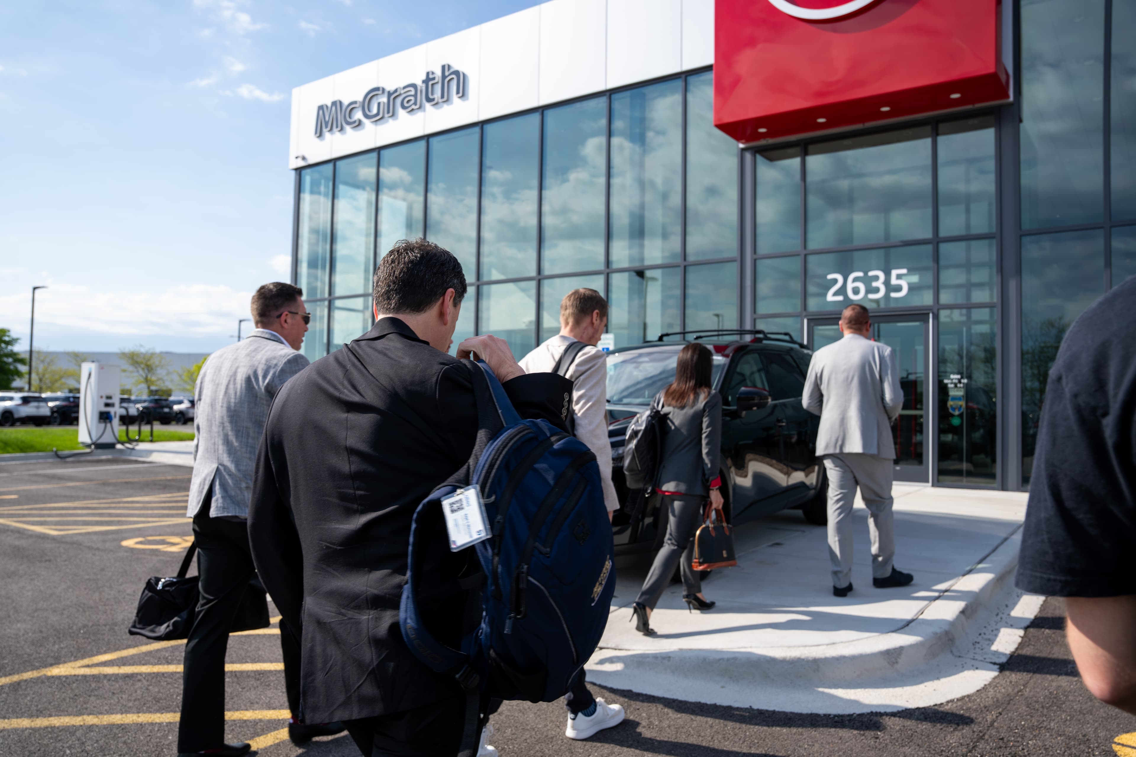 The Coleman Prime executive team walking into Nissan of Elgin