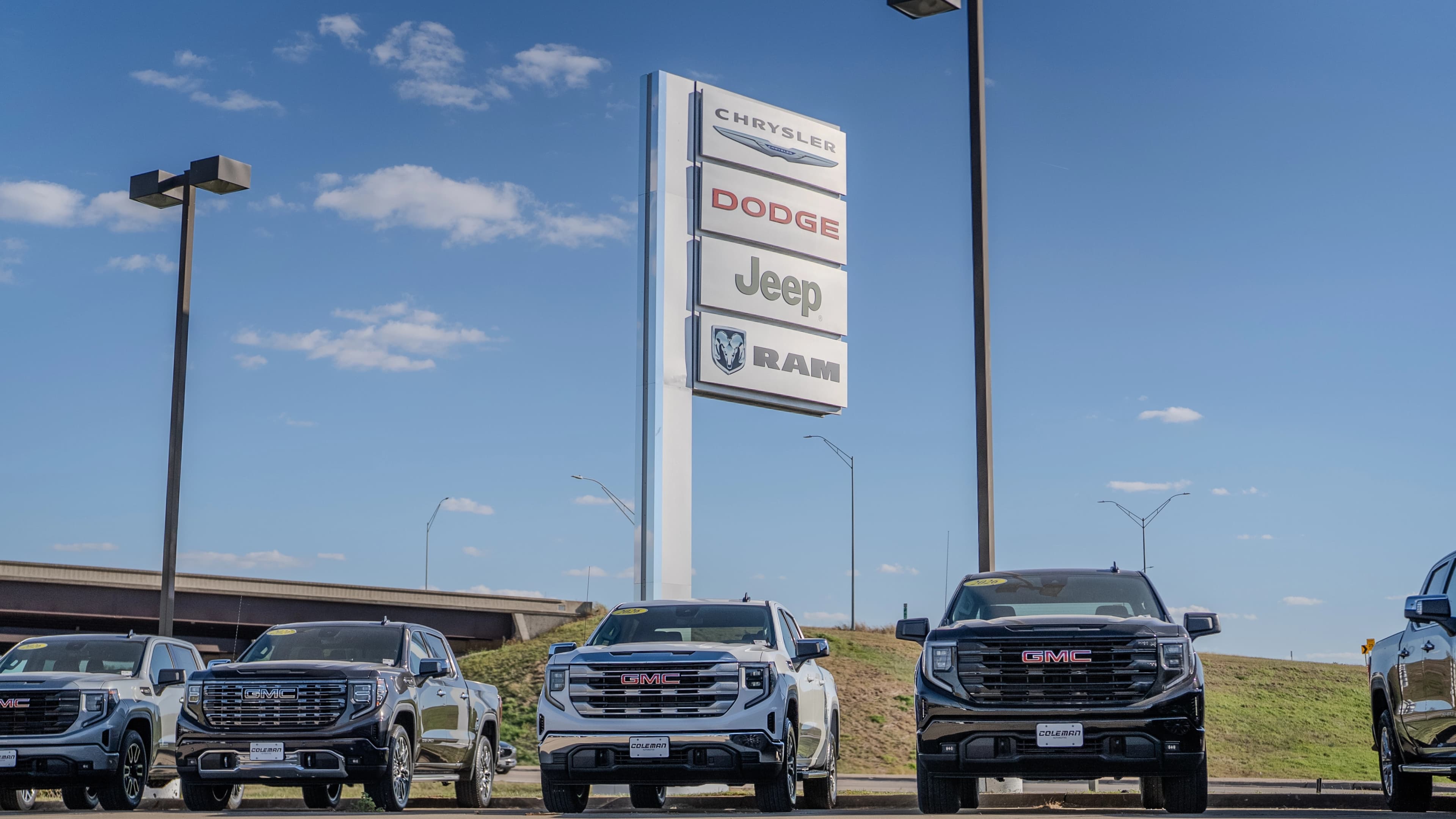 Coleman Automotive dealership with brand signage showing portfolio scale and diversification
