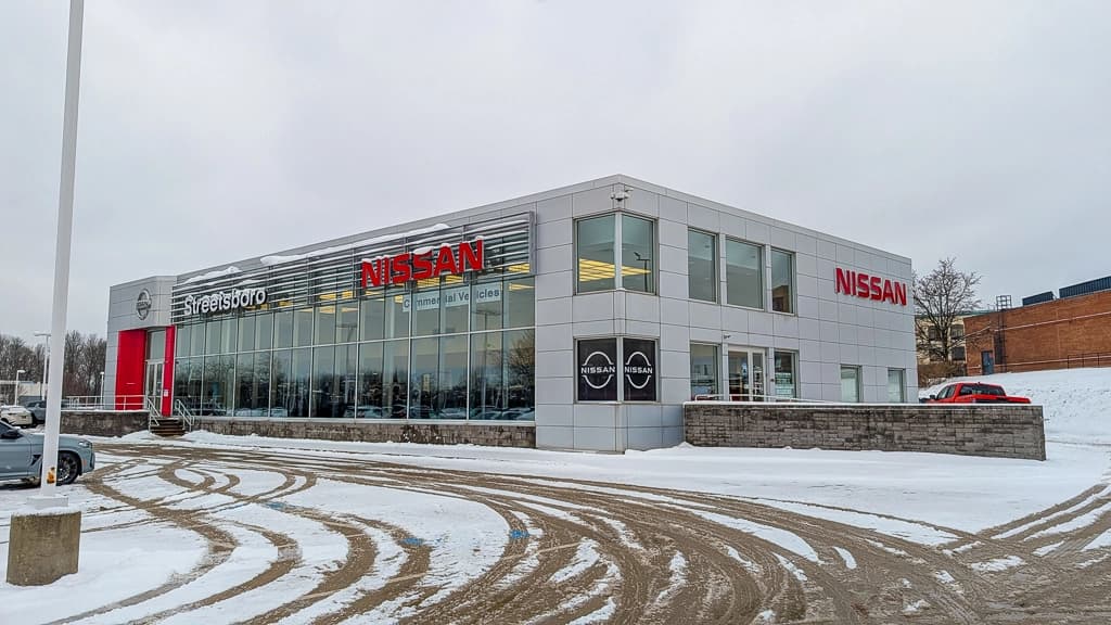 The Coleman Automotive leadership team gathered at a dealership location
